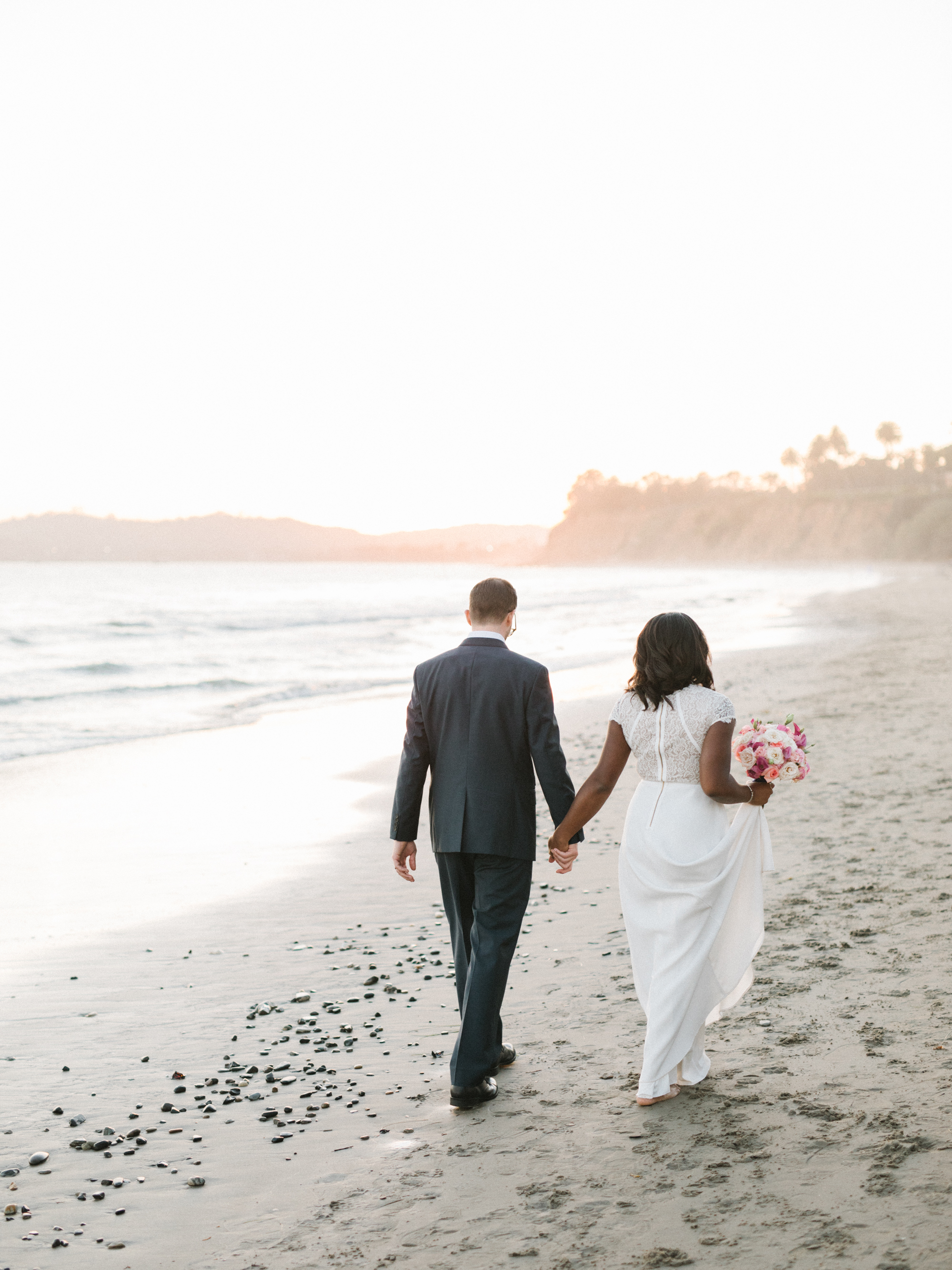 Bride and groom portraits at Butterfly Beach in Montecito